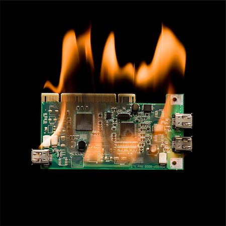 computer chip on fire Stock Photo - Premium Royalty-Free, Code: 640-02952201