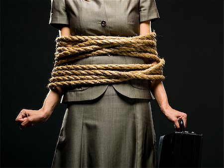 businesswoman all tied up with ropes Foto de stock - Sin royalties Premium, Código: 640-02952214