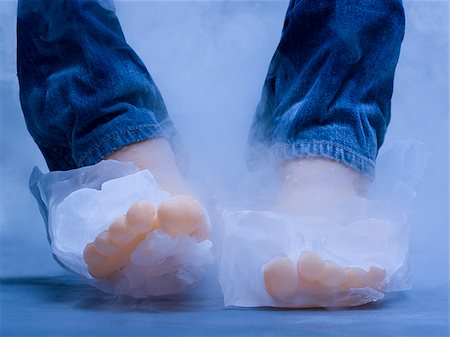two feet frozen in blocks of ice Stock Photo - Premium Royalty-Free, Code: 640-02952254