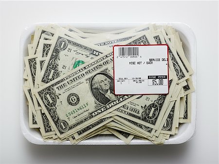 us dollars in a supermarket shrinkwrap package Stock Photo - Premium Royalty-Free, Code: 640-02952319
