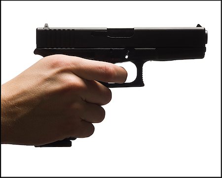 person hand on gun - glock handgun Stock Photo - Premium Royalty-Free, Code: 640-02952339