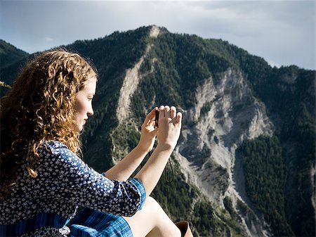 woman in a floral print dress on a mountain top Stock Photo - Premium Royalty-Free, Code: 640-02952460