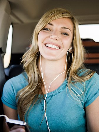 woman listening to music on a car ride Stock Photo - Premium Royalty-Free, Code: 640-02952734