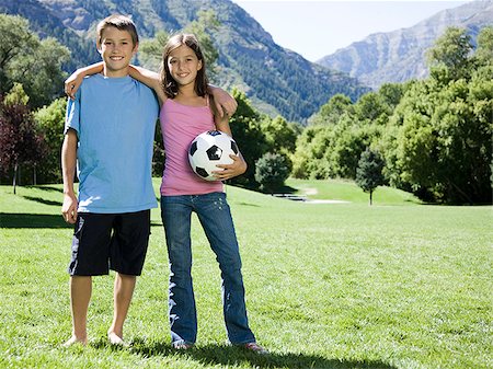 soccer girls images - brother and sister with a soccer ball Stock Photo - Premium Royalty-Free, Code: 640-02952930