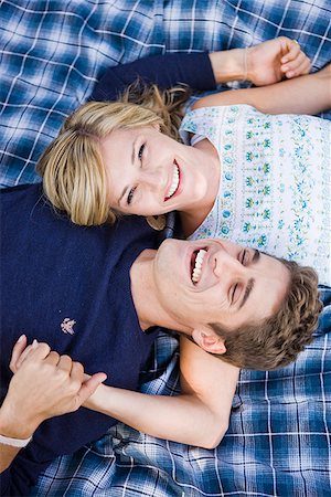 simsearch:640-02953202,k - couple lying on a blanket smiling Stock Photo - Premium Royalty-Free, Code: 640-02953025