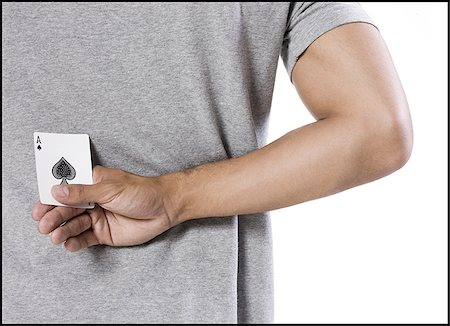 poker - man holding an ace of spades behind his back Foto de stock - Sin royalties Premium, Código: 640-02953031