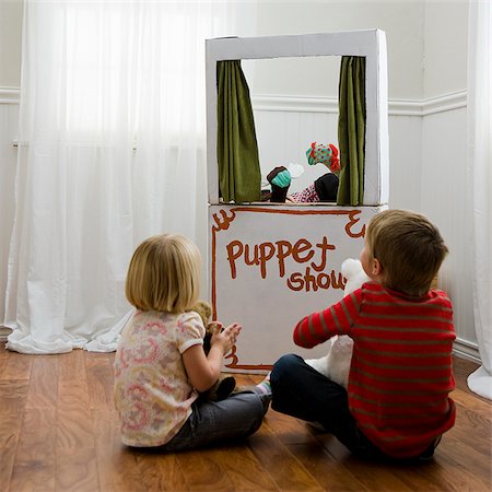people and theater stage - children watching a puppet show Stock Photo - Premium Royalty-Free, Code: 640-02953043