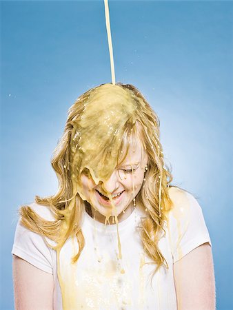 simsearch:640-02953105,k - woman getting orange juice poured on her head Fotografie stock - Premium Royalty-Free, Codice: 640-02953079