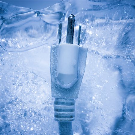 electrical plug frozen in a block of ice Stock Photo - Premium Royalty-Free, Code: 640-02953156