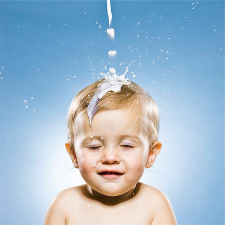 slim child - baby boy getting milk poured on his head Stock Photo - Premium Royalty-Free, Code: 640-02953184