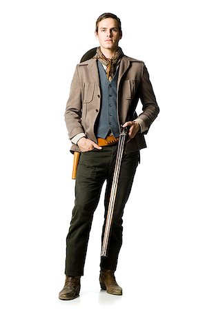 cowboy holding a shotgun Stock Photo - Premium Royalty-Free, Code: 640-02953232