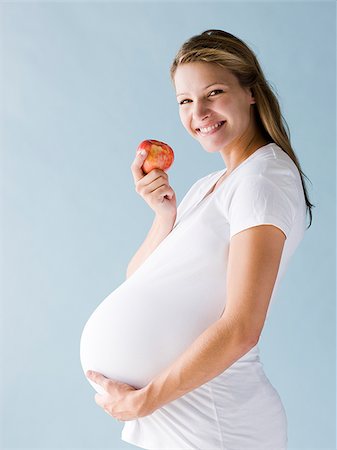 simsearch:640-03257126,k - pregnant woman eating an apple Fotografie stock - Premium Royalty-Free, Codice: 640-02953264