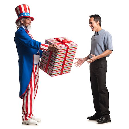 uncle sam giving a man a present Stock Photo - Premium Royalty-Free, Code: 640-02953351