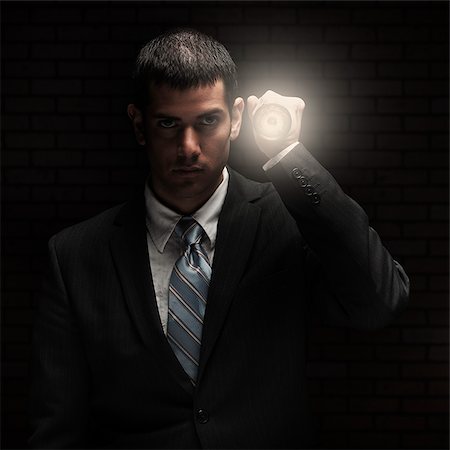flashlight - businessman holding a flashlight Stock Photo - Premium Royalty-Free, Code: 640-02953487