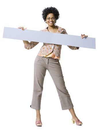 Woman holding blank sign Stock Photo - Premium Royalty-Free, Code: 640-03255390