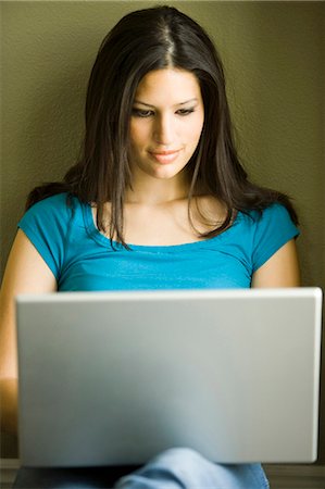 Woman working on laptop Stock Photo - Premium Royalty-Free, Code: 640-03255408