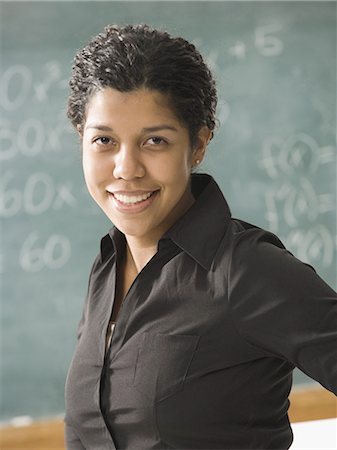 south american ethnicity - Young person  posing in front of chalkboard Stock Photo - Premium Royalty-Free, Code: 640-03255437