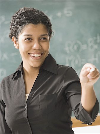 simsearch:640-03258375,k - Young person  posing in front of chalkboard Foto de stock - Sin royalties Premium, Código: 640-03255438