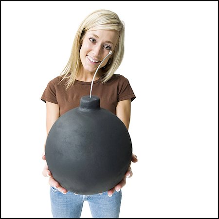 explosif - Femme posant et en tenant la bombe Photographie de stock - Premium Libres de Droits, Code: 640-03255464