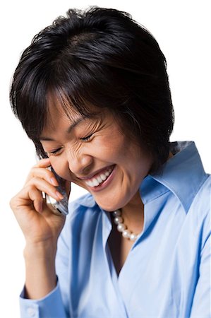 Woman talking on wireless phone,smiling. Stock Photo - Premium Royalty-Free, Code: 640-03255500