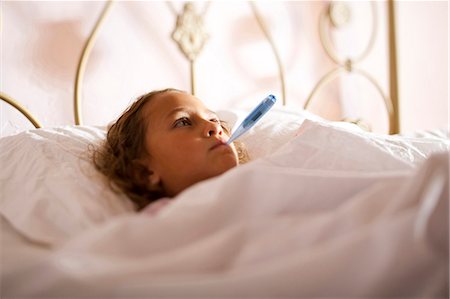 sick girl in bed - Little girl with fever Stock Photo - Premium Royalty-Free, Code: 640-03255647