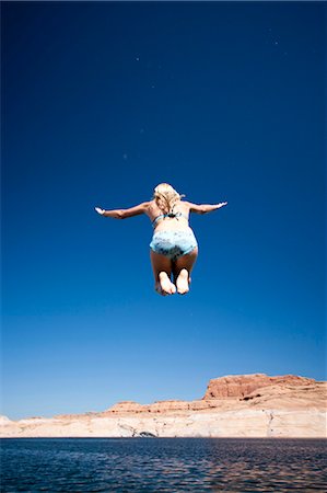 Person leaping in the air Stock Photo - Premium Royalty-Free, Code: 640-03255689