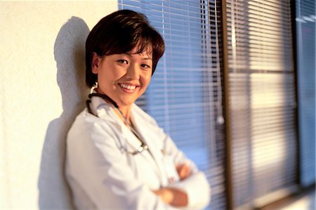 portrait and woman and closeup and arms - Hospital worker posing Stock Photo - Premium Royalty-Free, Code: 640-03255820