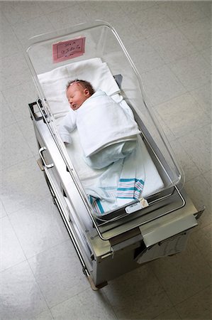 Newborn girl in nursery from above Stock Photo - Premium Royalty-Free, Code: 640-03255842