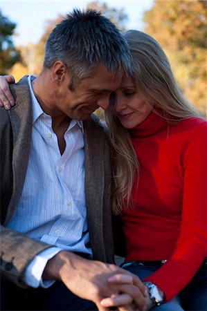 Couple sitting by water Stock Photo - Premium Royalty-Free, Code: 640-03255866