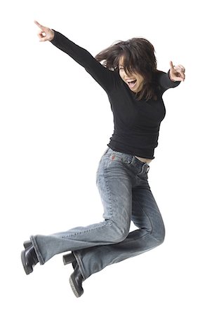 Casually dressed woman leaping Stock Photo - Premium Royalty-Free, Code: 640-03255957