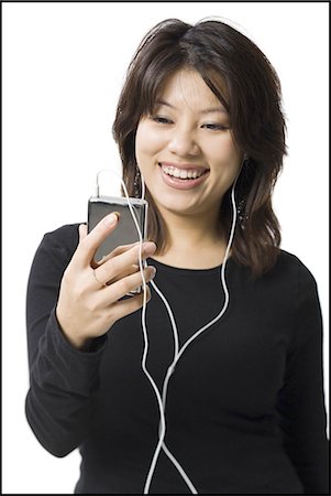 simsearch:640-02773489,k - Woman with mp3 player smiling Fotografie stock - Premium Royalty-Free, Codice: 640-03255964