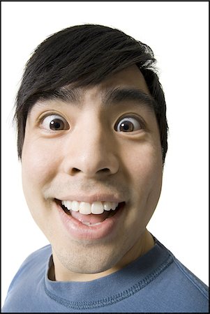 exaggerating - Man smiling Stock Photo - Premium Royalty-Free, Code: 640-03256100