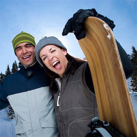 skier standing on mountain - A couple outside in the snow Stock Photo - Premium Royalty-Free, Code: 640-03256131