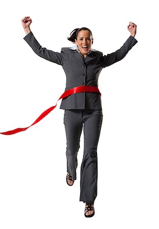 first place - Businesswoman crossing finish line Stock Photo - Premium Royalty-Free, Code: 640-03256148