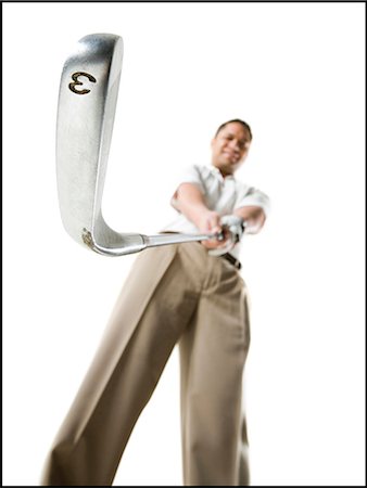 Golfer swinging club Stock Photo - Premium Royalty-Free, Code: 640-03256207