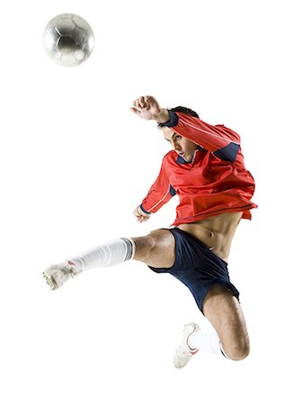 soccer player men game soccer ball kicking - Man jumping for soccer ball Stock Photo - Premium Royalty-Free, Code: 640-03256208