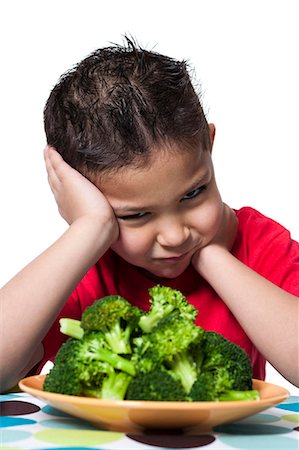 simsearch:640-03260960,k - Boy with plate of broccoli frowning Stock Photo - Premium Royalty-Free, Code: 640-03256227