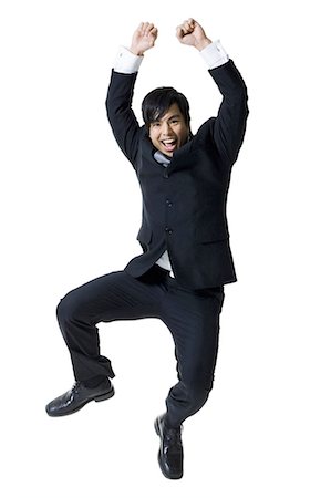 Businessman jumping in the air Stock Photo - Premium Royalty-Free, Code: 640-03256245