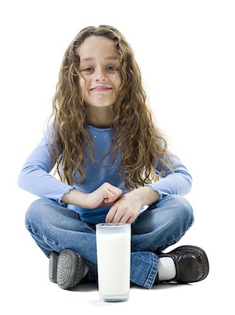 Young girl with a glass of milk Stock Photo - Premium Royalty-Free, Code: 640-03256254