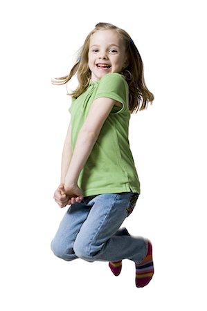 people young jumping happy - Young girl jumping in air Stock Photo - Premium Royalty-Free, Code: 640-03256260