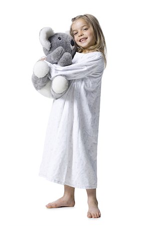 silhouette and hug - Young girl in nightie holding koala bear plush toy Stock Photo - Premium Royalty-Free, Code: 640-03256263