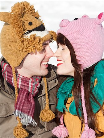 simsearch:640-03257281,k - Orem, Utah, USA, boyfriend and girlfriend wearing funny knit hats touching with noses Foto de stock - Sin royalties Premium, Código: 640-03256358