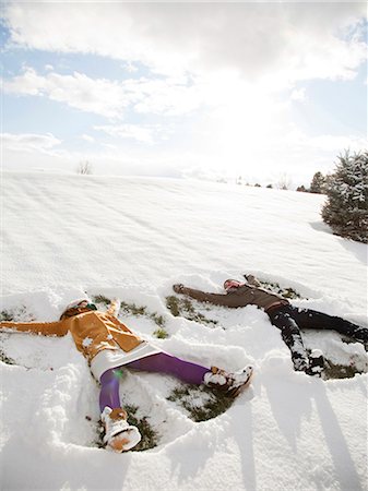 snow angel - Orem, Utah, USA, young couple making snow angels Stock Photo - Premium Royalty-Free, Code: 640-03256360