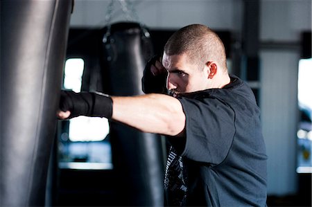 punching bag - USA Utah, American Fork, Boxer punching boxing bag Stock Photo - Premium Royalty-Free, Code: 640-03256494