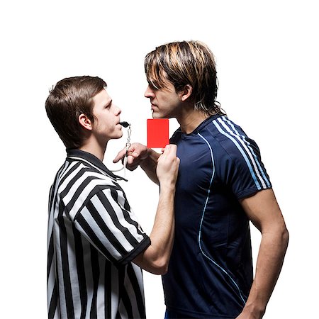 referee (male) - Studio shot of referee showing red card to player Foto de stock - Sin royalties Premium, Código: 640-03256492