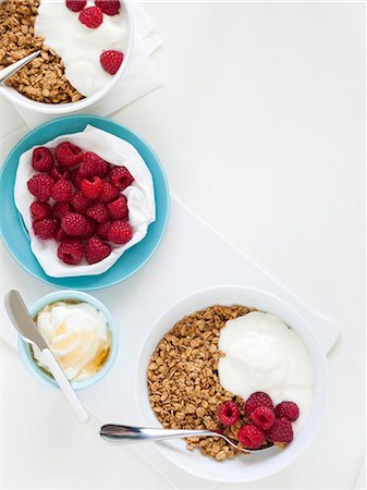 Healthy breakfast with cereals and fresh raspberries, studio shot Stock Photo - Premium Royalty-Free, Code: 640-03256532