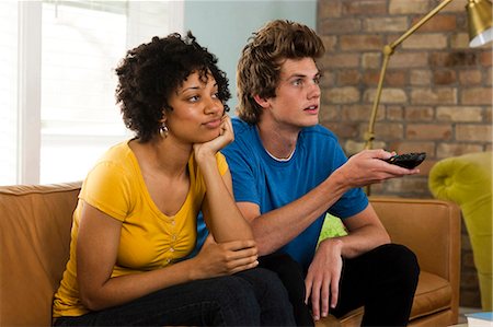 USA, Utah, Provo, young couple watching television in living room Stock Photo - Premium Royalty-Free, Code: 640-03256594