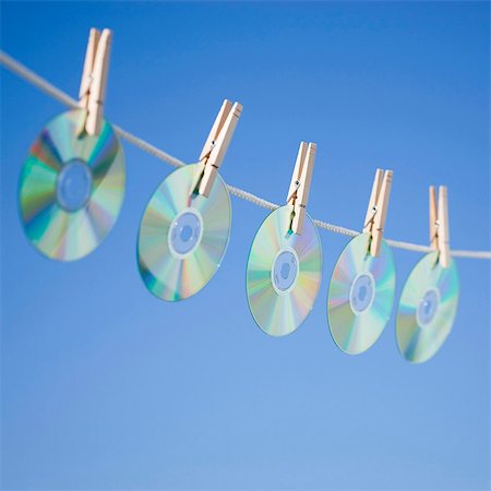 DVDs hanging on washing line Stock Photo - Premium Royalty-Free, Code: 640-03256634