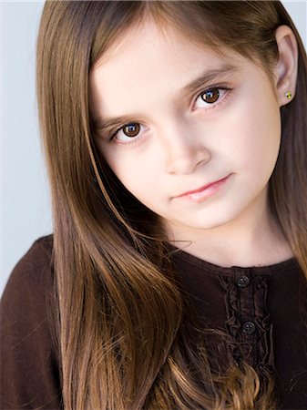 sincere - Studio portrait of girl (8-9) with brown hair Stock Photo - Premium Royalty-Free, Code: 640-03256757