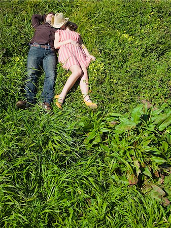 USA, California, San Francisco, young couple lying on back on grass Stock Photo - Premium Royalty-Free, Code: 640-03256917